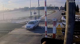Car stuck on level crossing dragged to safety seconds before train arrives