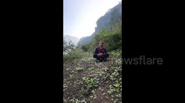 Man documents vegetable plot growth and he films timelapse of plants growing around him