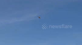A police helicopter flies over the skies of Rome on a beautiful sunny day in February in Rome.
