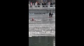 Woman stranded in frozen lake rescued in China