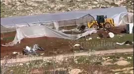 Israel: Israeli bulldozers demolish greenhouses for Palestinian farmers east of the town of Al-Issawiya in Jerusalem