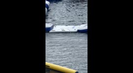 Inflatable chaos ensues as people struggle to complete Aquaglide challenge track