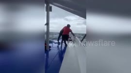 Coast Guard saves 14 people from sinking boat in the Philippines