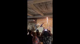Sheep jumps through ring of fire and balances on barrel at farm show