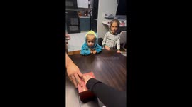 Child gets startled by fake butterflies from explosion box in Boston, USA