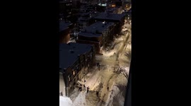 People ski through snow-filled streets in Montreal after snowstorm