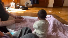 Baby fiercely refuses to give up item to relative