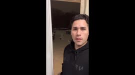Man measures deep snow with bare hand as winter storm sweeps Virginia, USA