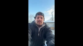 Skater glides on ice formed by flooding in Detroit, Michigan, USA