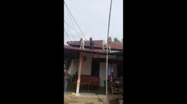 Goat spotted on house roof runs away when called in Tulungagung, Indonesia