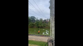 Woman gets stuck on zipline and rescued in Jambi, Indonesia