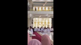 Man slips during wedding ceremony documentation in Polewali Mandar, West Sulawesi, Indonesia