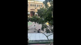 Priest plays badminton in Manila