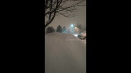 Snowstorm blankets vehicles during winter storm in Kitchener, Ontario, Canada