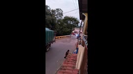Kid falls from bicycle while attempting to ride without hands in Managua, Nicaragua