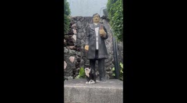 Cat poses beside Rizal statue in Quezon City, Philippines