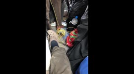 Man knits his own seat in crowded train in Kerala, India
