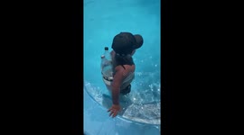 Nephew uses empty plastic bottles as pool floaters in Buenos Aires, Argentina