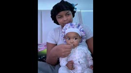 Baby's reaction to shared snacks in Detroit, Michigan