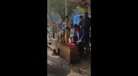 Man shares food with monkey in New Delhi