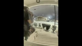 Security camera captures man slipping on snowy ground in Augusta, Georgia, USA