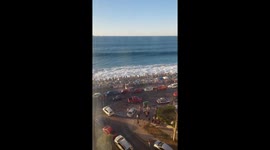 Waves push water past oceanfront in Viña del Mar, Chile