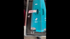 Traveler tests weighing machines at Chandigarh Airport in Punjab, India