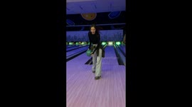 Woman gets a strike while bowling backward in Almaty, Kazakhstan