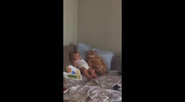 Daughter and cat share a sweet moment on the couch