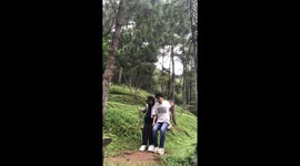 Two friends fall from swing in Kuningan, Java, Indonesia