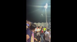 Rival fans hurl plastic beer bottles during football game in Thailand