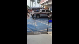 Shocked British tourist watches police grapple with irate Chinese man in station