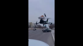 Drone delivers croissant to construction workers on building site
