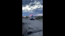 German Shepherd Rides Atop Pickup Truck