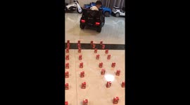 Chinese child flawlessly parks toy car in 20 seconds using milk bottle barriers