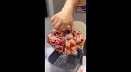 Chinese man uses air fryer as mini hanging roaster
