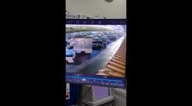 Motorcycle rider crashes into parked car when wooden board blows into his face