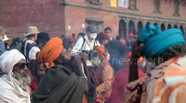 Hindu holy man, or Sadhu, smokes marijuana on the Maha Shivaratri festival at the Pashupati temple in Kathmandu, Nepal.