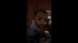 Baby adorably poses for the camera like a natural born model