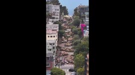 Motorcycles ride down Lombard St in San Francisco