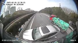 Car fails overtake attempt and gets pushed over 200 metres by truck in China