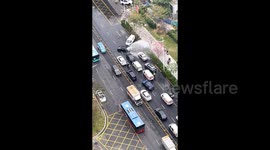 Van crashes into water pump in China - passing drivers queue for free car wash