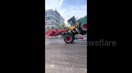 Drivers perform impressive stunts with huge loaders