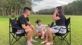 Toddler delighted to see her parents kiss