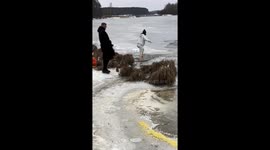 Woman Rescues Dog From Freezing River