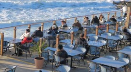 UK Weather, Spring promise lures folk back into the Ocean Fistral Beach, Cornwall, UK