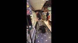 Man Hooks Grocery Basket Onto Pants