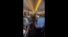 Walk down the aisle of a Boeing 777 mid-flight