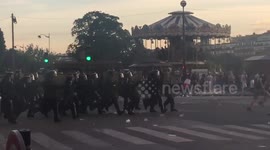 Riot police charge at football supporters in Paris