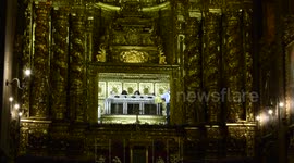 People visiting the mummified corpse of the Queen Saint in Coimbra Portugal